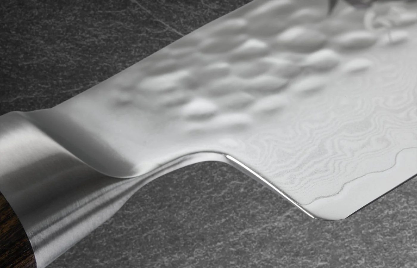 Close view of the heel and Damascus layers on a Shun Premier knife